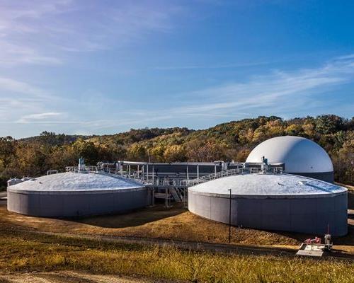 Domed grey and white wastewater processing tanks